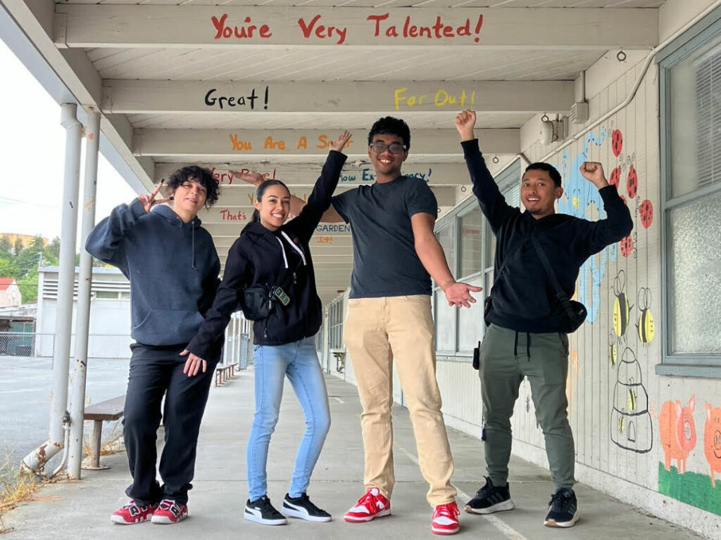 Building Connections Academy students posing in the school hallway